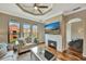 Beautifully decorated living room with fireplace and a view of the neighborhood at 2722 Via Tivoli # 432B, Clearwater, FL 33764
