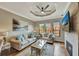 Comfortable living room with fireplace, hardwood floors, and natural light at 2722 Via Tivoli # 432B, Clearwater, FL 33764