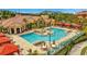 Community amenities include a large swimming pool, seating areas and landscaping at 2722 Via Tivoli # 432B, Clearwater, FL 33764