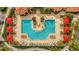 Aerial view of community swimming pool, seating areas and landscaping at 2722 Via Tivoli # 432B, Clearwater, FL 33764
