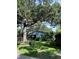 Charming home with large trees, lush landscaping, and a beautifully maintained yard at 2816 W Bay Ave, Tampa, FL 33611