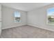 Bright bedroom featuring neutral walls and carpet at 3024 W Cass St, Tampa, FL 33609