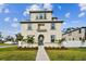 Tan two-story house with a walkway and landscaping at 3024 W Cass St, Tampa, FL 33609
