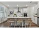 Modern kitchen with white cabinets and island at 3024 W Cass St, Tampa, FL 33609