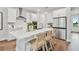 Modern kitchen with white cabinets and island at 3024 W Cass St, Tampa, FL 33609