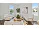 Light and airy living room with hardwood floors and ample natural light at 3024 W Cass St, Tampa, FL 33609