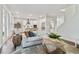Bright living room featuring a comfortable sofa and coffee table at 3024 W Cass St, Tampa, FL 33609