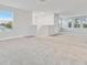 Open loft area with carpet and multiple windows at 3024 W Cass St, Tampa, FL 33609