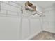 Large walk-in closet with ample shelving and hanging space at 3024 W Cass St, Tampa, FL 33609
