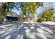 House exterior showcasing driveway and lush landscaping at 314 33Rd Ne Ave, St Petersburg, FL 33704