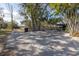 Side view of house showing carport and surrounding trees at 314 33Rd Ne Ave, St Petersburg, FL 33704