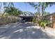 Modern house exterior featuring a carport and tropical landscaping at 314 33Rd Ne Ave, St Petersburg, FL 33704