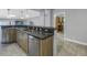 Kitchen with stainless steel appliances and dark wood cabinets at 314 33Rd Ne Ave, St Petersburg, FL 33704
