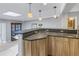 Modern kitchen with breakfast bar and dark granite countertops at 314 33Rd Ne Ave, St Petersburg, FL 33704