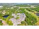 An aerial view showcases the complex surrounded by a lush green landscape at 3151 Landmark Dr # 123, Clearwater, FL 33761