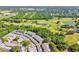 An aerial view shows the complex surrounded by a lush green golf course at 3151 Landmark Dr # 123, Clearwater, FL 33761