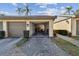 Open garage, showing the contents inside and a glimpse of the building exterior and landscape at 3151 Landmark Dr # 123, Clearwater, FL 33761