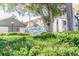 Eagles Glen community sign surrounded by lush landscaping with palm trees at 3151 Landmark Dr # 123, Clearwater, FL 33761