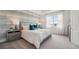 Bedroom with large window and accent wall at 32710 Rustic Rise Rd, San Antonio, FL 33576