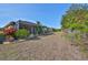 Spacious backyard with screened patio and lush landscaping at 335 Siena Vista Pl, Sun City Center, FL 33573