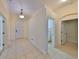 Light and bright entryway with tile flooring and access to laundry at 335 Siena Vista Pl, Sun City Center, FL 33573