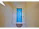 Bright blue front door with a small welcome mat at 335 Siena Vista Pl, Sun City Center, FL 33573