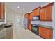 Well-equipped kitchen with ample cabinetry and granite countertops at 335 Siena Vista Pl, Sun City Center, FL 33573