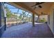 Spacious screened patio with brick pavers and ceiling fan at 335 Siena Vista Pl, Sun City Center, FL 33573