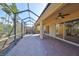 Extended screened patio with multiple access points at 335 Siena Vista Pl, Sun City Center, FL 33573