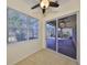 Bright sunroom with sliding glass doors leading to a screened patio at 335 Siena Vista Pl, Sun City Center, FL 33573