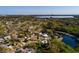 Aerial view of a waterfront neighborhood with lush landscape and skyline view at 346 80Th Ne Ave, St Petersburg, FL 33702