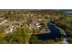 Waterfront property featuring beautiful landscaping and stunning views of the adjacent pond at 346 80Th Ne Ave, St Petersburg, FL 33702