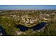 Waterfront property featuring a serene pond and beautiful surrounding landscape, providing privacy and tranquility at 346 80Th Ne Ave, St Petersburg, FL 33702