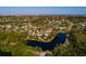 Scenic waterfront lot with mature trees and a tranquil pond, offering picturesque views and privacy at 346 80Th Ne Ave, St Petersburg, FL 33702