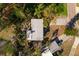 Aerial view of home with gray roof surrounded by green landscaping at 346 80Th Ne Ave, St Petersburg, FL 33702