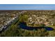 Scenic waterfront lot with lush greenery and mature trees, offering picturesque views of the tranquil pond at 346 80Th Ne Ave, St Petersburg, FL 33702