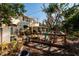 Outdoor living space with a wooden deck, seating, and a landscaped yard, creating a welcoming area for relaxation at 346 80Th Ne Ave, St Petersburg, FL 33702