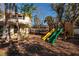 A large backyard features a play structure, trampoline, and plenty of space for recreation at 346 80Th Ne Ave, St Petersburg, FL 33702