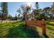 Entrance to Rio Vista Park, City of St. Petersburg, with lush lawn and mature trees at 346 80Th Ne Ave, St Petersburg, FL 33702
