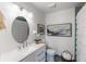 Updated bathroom with white vanity and oval mirror at 3824 37Th S St # 67, St Petersburg, FL 33711