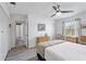 Cozy bedroom with a ceiling fan and en-suite bathroom at 3824 37Th S St # 67, St Petersburg, FL 33711