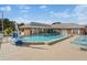 Community pool with a lift and lounge chairs at 3824 37Th S St # 67, St Petersburg, FL 33711