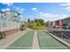 Community shuffleboard court with green surface and surrounding landscaping at 3824 37Th S St # 67, St Petersburg, FL 33711