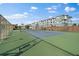 Community tennis court with green surface and surrounding fence at 3824 37Th S St # 67, St Petersburg, FL 33711