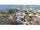 Residential neighborhood with houses, palm trees and waterway in the background at 4523 Clearwater Harbor S Dr, Largo, FL 33770