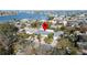 Aerial view of the property with waterfront views, mature landscaping, and a convenient location at 4523 Clearwater Harbor S Dr, Largo, FL 33770