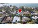 Aerial view of the property nestled among lush trees and landscaping, close to the waterfront at 4523 Clearwater Harbor S Dr, Largo, FL 33770