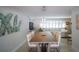 Comfortable dining area featuring modern lighting, ample seating, and open access to living spaces at 4523 Clearwater Harbor S Dr, Largo, FL 33770