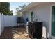 Exterior view shows the home's air conditioning system and a well-maintained side yard at 4523 Clearwater Harbor S Dr, Largo, FL 33770