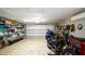 Spacious garage with epoxy floors featuring ample storage and space for parking motorcycles and other recreational vehicles at 4523 Clearwater Harbor S Dr, Largo, FL 33770